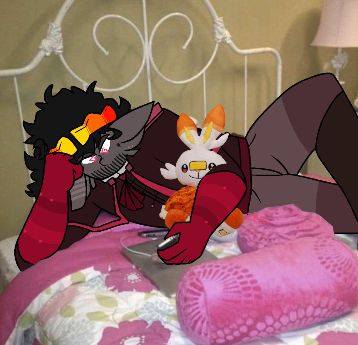 A picture of 2k with a scorbunny plush under his arm looking at a phone. He's sprawled out on a very pink bed.